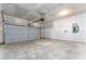 This two-car garage includes an electric garage door and a concrete floor at 192 Bruce Dr, Dunn, NC 28334