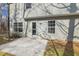 Backyard concrete patio with a sliding glass door access to the home; perfect for outdoor seating and entertaining at 201 Timber Meadow Lk, Fuquay Varina, NC 27526
