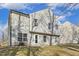 View of the home's backyard with siding and a door leading inside from a covered porch at 201 Timber Meadow Lk, Fuquay Varina, NC 27526