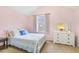 Cozy bedroom with light pink walls, plush carpet and natural light from the window at 201 Timber Meadow Lk, Fuquay Varina, NC 27526