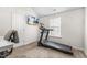 Home gym featuring a treadmill, bright light from window, with neutral colored walls and carpet at 201 Timber Meadow Lk, Fuquay Varina, NC 27526