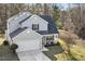 Aerial view of the two-story home showing the front yard, driveway, and garage at 201 Timber Meadow Lk, Fuquay Varina, NC 27526