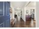 Warm, inviting foyer with hardwood floors, bench seating, and natural light filtering through to the living area at 201 Timber Meadow Lk, Fuquay Varina, NC 27526