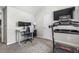 Home office with carpeting and neutral walls includes a treadmill for staying fit while working at 201 Timber Meadow Lk, Fuquay Varina, NC 27526