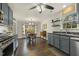 Open concept kitchen features blue cabinets, stainless steel appliances, and an adjacent dining area at 201 Timber Meadow Lk, Fuquay Varina, NC 27526
