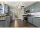 Spacious kitchen featuring modern appliances, blue cabinets and an open view into the dining area at 201 Timber Meadow Lk, Fuquay Varina, NC 27526