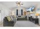 Cozy living area with vaulted ceilings, plush seating, and a modern entertainment setup at 201 Timber Meadow Lk, Fuquay Varina, NC 27526