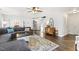 Open-concept living room with a large sectional sofa and view of dining area at 201 Timber Meadow Lk, Fuquay Varina, NC 27526