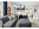 Living room with a sectional sofa, TV, and view into the bathroom at 201 Timber Meadow Lk, Fuquay Varina, NC 27526