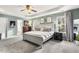 Charming bedroom with neutral colors, large windows, and ensuite bathroom at 201 Timber Meadow Lk, Fuquay Varina, NC 27526