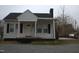 Charming one story home featuring black shutters, front porch and a quaint design at 2110 Carolina Mill Rd, Burlington, NC 27217