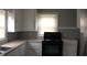 Bright kitchen featuring white cabinets, gray walls, and an electric range at 2110 Carolina Mill Rd, Burlington, NC 27217