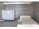 Laundry area with a washing machine and built-in cabinets at 2110 Carolina Mill Rd, Burlington, NC 27217
