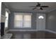 Light-filled living room with hardwood floors and ceiling fan near the entry door at 2110 Carolina Mill Rd, Burlington, NC 27217