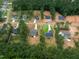 An aerial view shows the layout of homes in a wooded community at 215 Purslane Dr, Franklinton, NC 27525