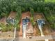 New construction home from above shows a long driveway and green surroundings at 215 Purslane Dr, Franklinton, NC 27525