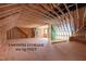 A large unfinished attic offers 900 square feet of potential storage space at 215 Purslane Dr, Franklinton, NC 27525