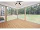 Back porch features wood floors and a screened-in enclosure, providing an outdoor living space at 215 Purslane Dr, Franklinton, NC 27525