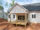 Exterior of a new home with a covered back porch and black metal handrails at 215 Purslane Dr, Franklinton, NC 27525