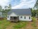 A spacious backyard featuring a screened-in porch, offering a perfect outdoor living space at 215 Purslane Dr, Franklinton, NC 27525