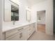 Bathroom featuring double vanity with quartz countertop and modern mirrors at 215 Purslane Dr, Franklinton, NC 27525