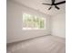 Bright bedroom with large windows, ceiling fan, and neutral carpet at 215 Purslane Dr, Franklinton, NC 27525