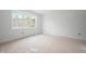 Bedroom featuring a large window that fills the space with natural light at 215 Purslane Dr, Franklinton, NC 27525