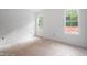 Bright bedroom with two large windows offering plenty of natural light at 215 Purslane Dr, Franklinton, NC 27525