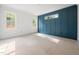 Well-lit room with wainscoting, two windows, and neutral-toned walls creating a calming atmosphere at 215 Purslane Dr, Franklinton, NC 27525