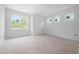 Bright bedroom featuring large windows that fill the space with natural light at 215 Purslane Dr, Franklinton, NC 27525