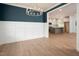 Bright and airy dining area with hardwood floors, modern lighting, and seamless access to the kitchen at 215 Purslane Dr, Franklinton, NC 27525
