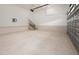 Spacious two-car garage with high ceilings, staircase, and unfinished walls at 215 Purslane Dr, Franklinton, NC 27525