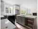 Bright and spacious kitchen with stainless steel appliances, a large island, and plenty of counter space at 215 Purslane Dr, Franklinton, NC 27525