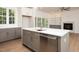 Kitchen showcasing the island, sink, stainless steel appliances, and layout of the home at 215 Purslane Dr, Franklinton, NC 27525