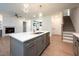 Kitchen featuring an island with a sink, appliances, and open layout for entertaining at 215 Purslane Dr, Franklinton, NC 27525
