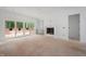 Unfinished living room featuring sliding glass doors and a fireplace with built-in shelving at 215 Purslane Dr, Franklinton, NC 27525