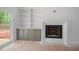 Interior view of a fireplace with built-in shelving and cabinets at 215 Purslane Dr, Franklinton, NC 27525