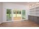 Bright and airy living room with sliding glass doors leading to an outdoor deck at 215 Purslane Dr, Franklinton, NC 27525