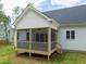 Detailed view of the screened-in porch, a cozy spot for relaxation and enjoying the outdoors at 215 Purslane Dr, Franklinton, NC 27525