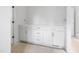 White cabinets with drawers and doors, topped with a light countertop at 215 Purslane Dr, Franklinton, NC 27525