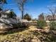 Lush backyard with green grass, mature trees, and a privacy fence perfect for outdoor enjoyment at 2521 St Mary'S St, Raleigh, NC 27609