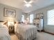 Bedroom featuring classic decor with twin beds and an ornate wardrobe at 2521 St Mary'S St, Raleigh, NC 27609