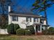 Beautiful white brick two-story home with black shutters and well-manicured landscaping at 2521 St Mary'S St, Raleigh, NC 27609