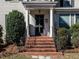 Inviting front porch with classic columns and brick steps leading to the main entrance at 2521 St Mary'S St, Raleigh, NC 27609