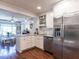 Stylish kitchen with white cabinets, stainless steel appliances, and a charming breakfast nook at 2521 St Mary'S St, Raleigh, NC 27609