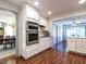 Modern kitchen featuring stainless steel appliances, white cabinets, and hardwood flooring at 2521 St Mary'S St, Raleigh, NC 27609