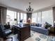 Bright home office with large windows, a work desk, and comfortable seating area at 2521 St Mary'S St, Raleigh, NC 27609