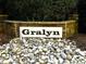 Gralyn community sign, constructed with stone, set among white rocks at 300 Barthel Dr, Cary, NC 27513