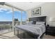 Inviting bedroom with a balcony offering stunning city views, combining comfort and urban living at 301 Fayettville St # 2908, Raleigh, NC 27601
