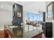 Modern kitchen featuring granite countertops and stainless steel appliances, offering seamless flow to the living area at 301 Fayettville St # 2908, Raleigh, NC 27601